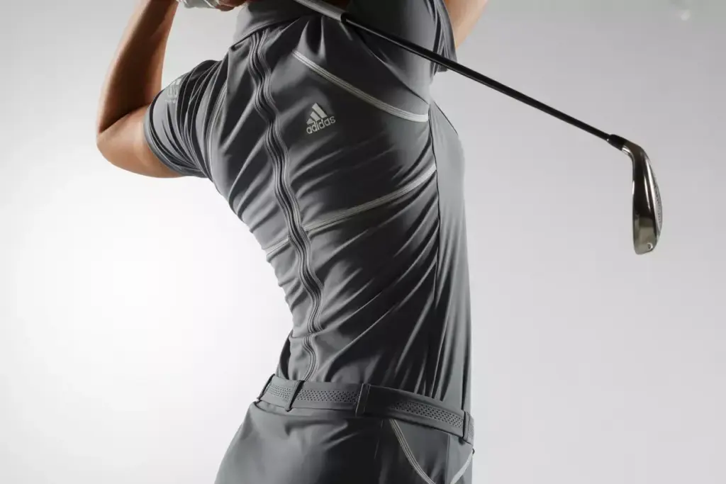 Close up of performance stretch dress panels during golf rotation