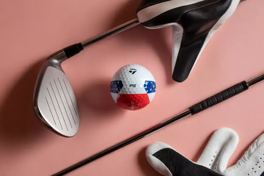 Taylormade tp5 red white birdie special ball and driver flat lay