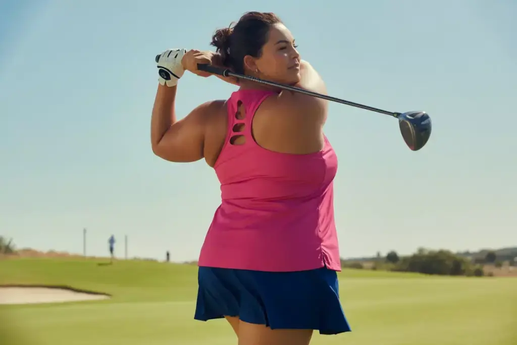 Plus size woman golf swing racerback tank top course