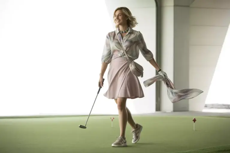 The Feminine Touch Outfit With A Flowy Blouse Golf Dress And Stylish Sneakers Putting