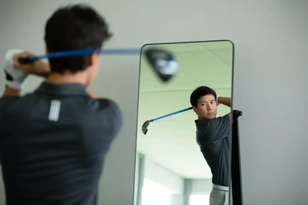 The Swing Plane Mirror Drill Golfer Checking Backswing Position In Full Length Mirror
