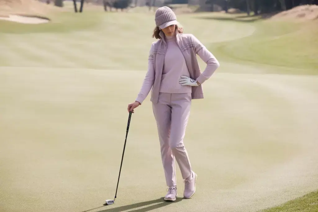 Feminine Chic Golfer In Tailored Pink And Cream Winter Layers