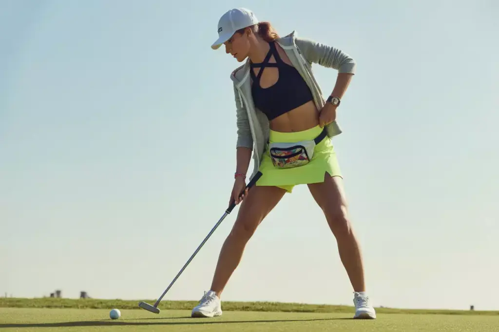 Neon shorts sports bra dynamic putting action shot