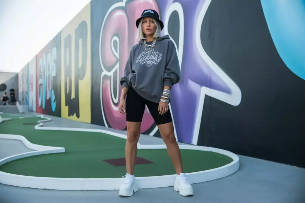 Bike shorts oversized hoodie graffiti mini golf backdrop