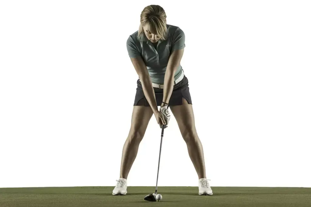 The Address Position Authority A Female Golfer In Perfect Setup Spine Tilted Chin Up Shoulders Back Arms Naturally Hanging Gripping Club