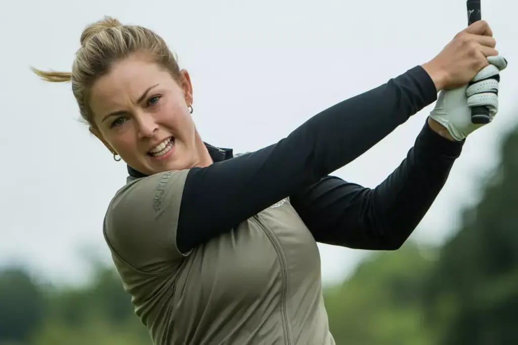 The Impact Intention A Female Golfer At The Moment Of Impact Hips Rotated Arms Extended Head Stable Showing Committed Powerful Motion