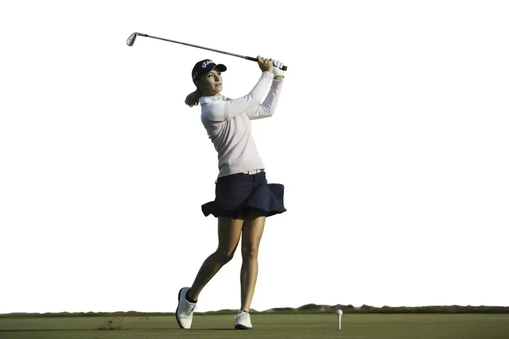 The Signature Finish Hold A Female Golfer In A Classic Balanced Finish Weight On Front Foot Chest Facing Target Expression Satisfied