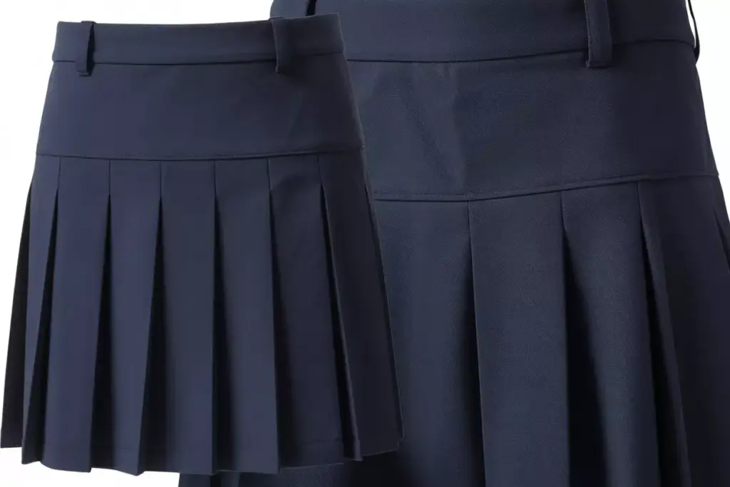 Classic navy pleated golf skirt with belt loops studio shot