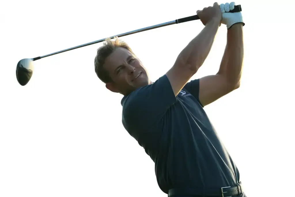 A Golfer Holding A Confident And Balanced Follow Through With Chest Open After The Swing