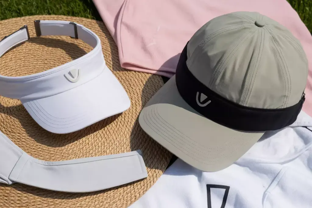 Flat lay of golf hats visors sun protection accessories