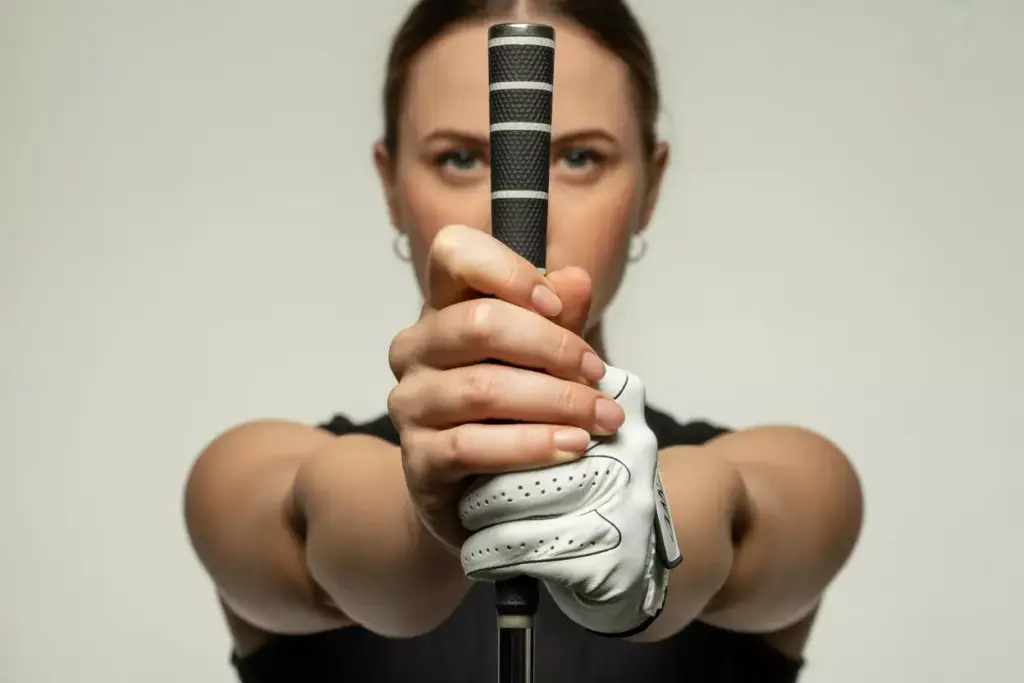 A Womans Hands Demonstrating The Perfect Overlapping Golf Grip With Gentle Pressure