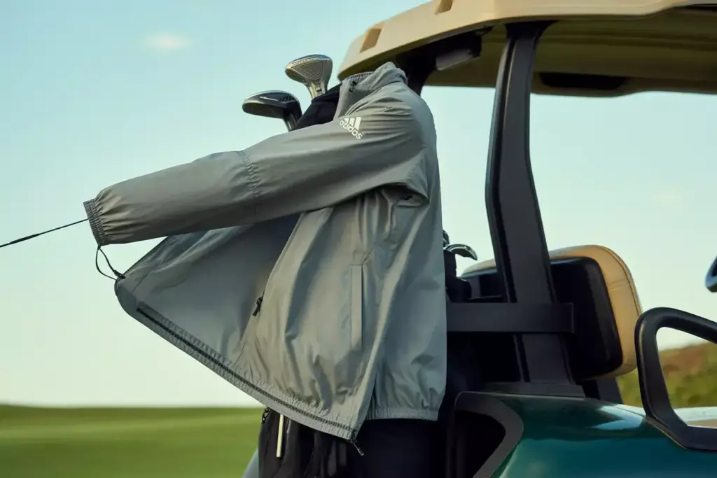 Lightweight upf wind jacket hanging on golf bag