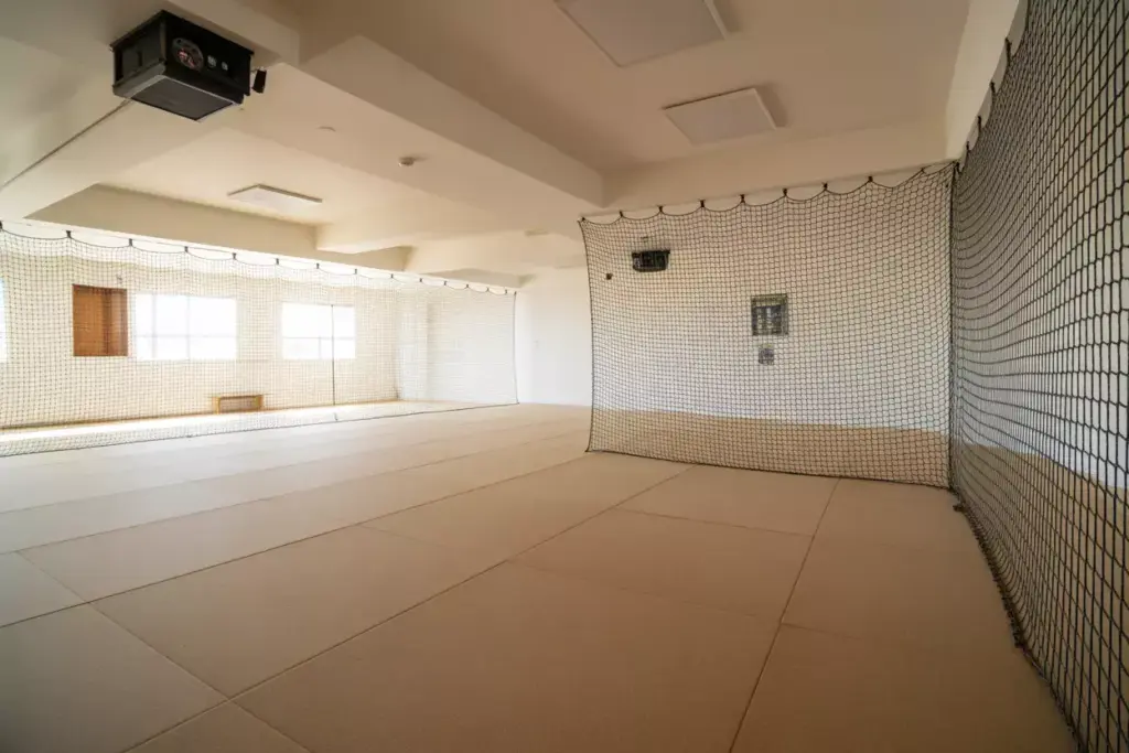 High Ceiling Room With Safety Netting And Shock Absorbing Flooring For Golf Simulator