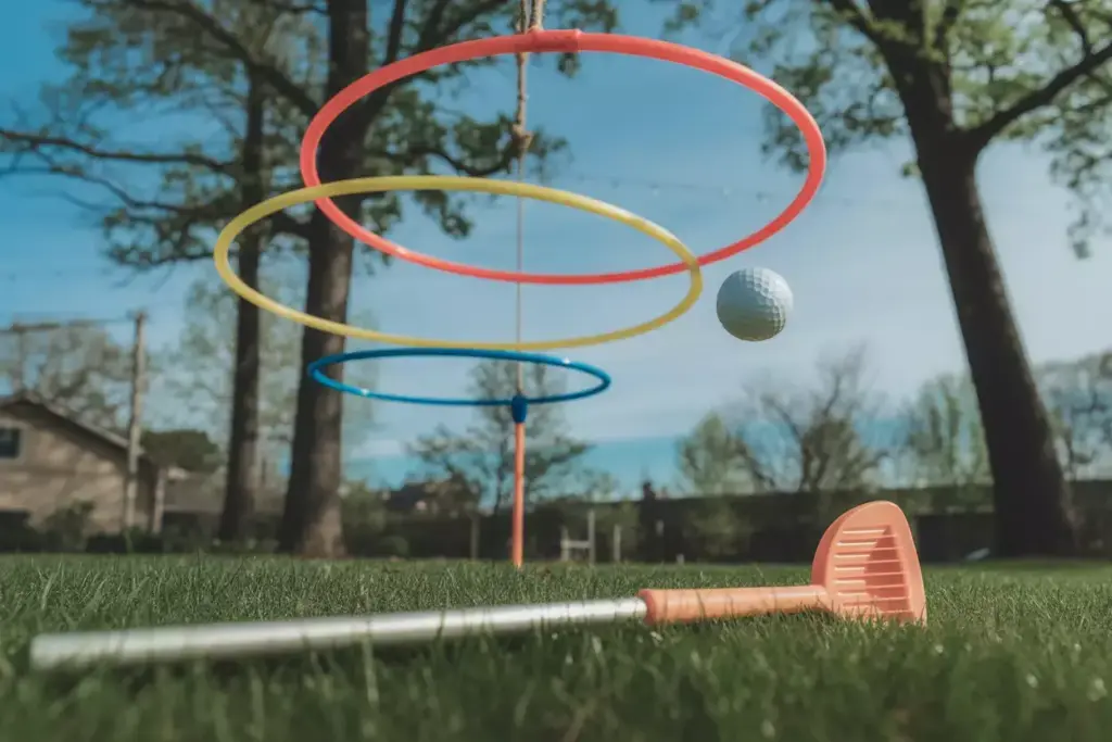 Colored Hula Hoops Suspended As Golf Targets In A Sunny Backyard