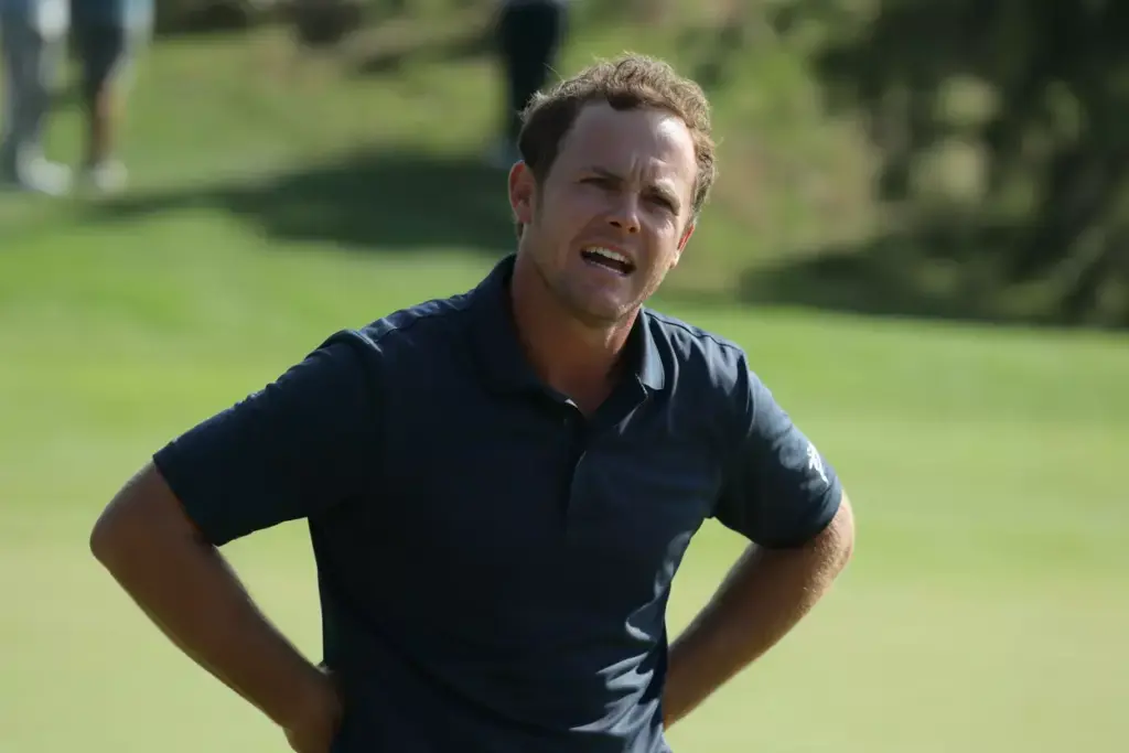 A Golfers Genuine Emotional Reaction Smile Or Grimace After A Shot On The Green