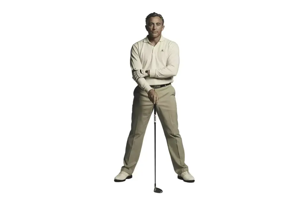 A Confident Golfer Standing With Club Vertical Professional Portrait For Business