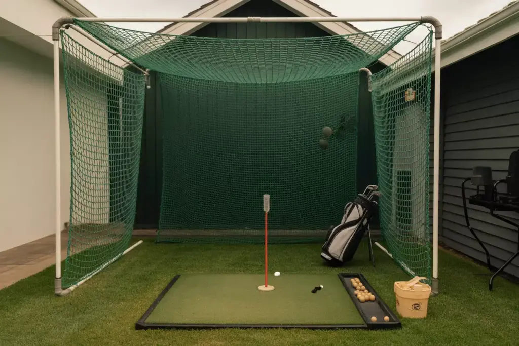 Portable Golf Practice Net And Hitting Mat In Small Backyard