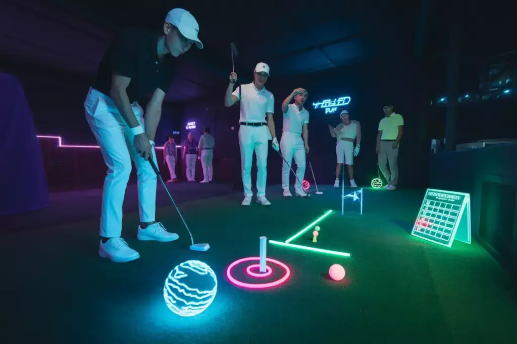Glow In The Dark Golf Adventure Neon Ball On Fluorescent Green Under Blacklights