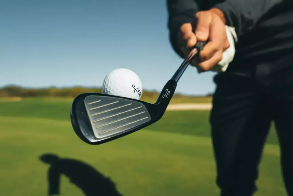 Golfer Hitting T150 Black Iron Approach Shot Fairway