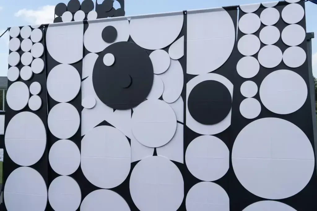 Black And White Geometric Pattern Of Overlapping Circles Like Golf Balls On A Modern Banner