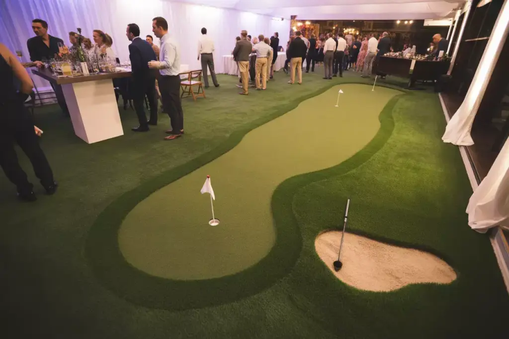 Artificial Turf Putting Green Installation Indoor Party Venue With Cocktail Station And Guests Mingling
