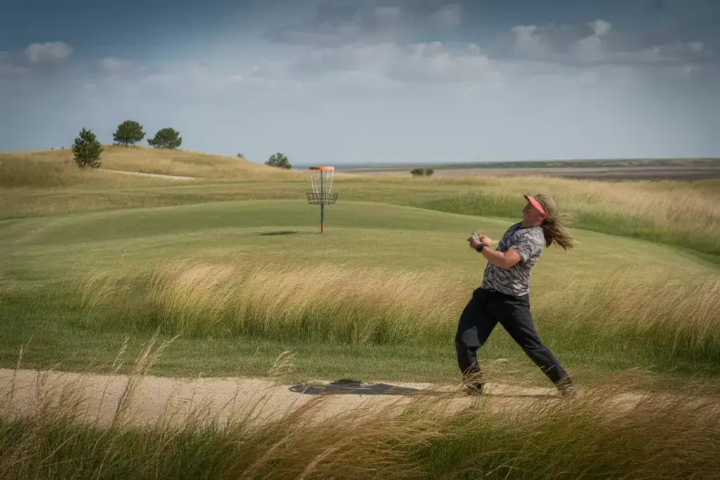 Dela Course Disc Golfer Battling Wind On Open Prairie Fairway Oklahoma