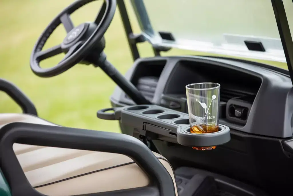 A Shatterproof Plastic Glass Securely Fitted In A Golf Cart Cup Holder